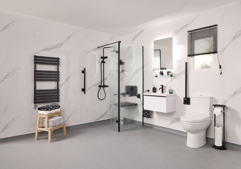 Luxury disabled wet room with marble effect walls and matte black grab rails
