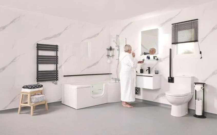 Algarve walk-in bathroom featuring additional accessible solutions such as grab rails, fold-down seats, and handheld showerheads.