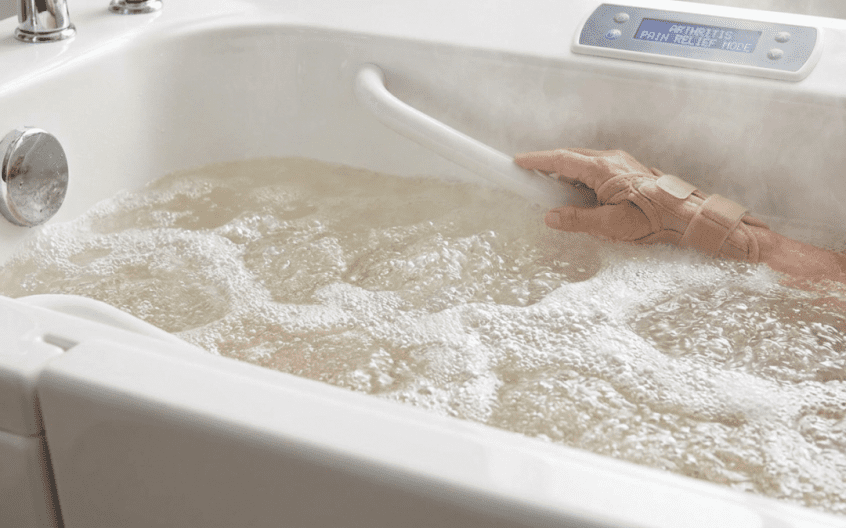 Close up of warm air spa bubbles in walk in bath for arthritis pain relief