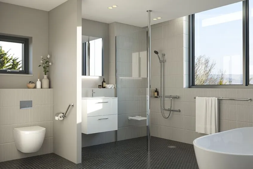 Warm beige accessible wet room with fold down shower seat and safety grab rails