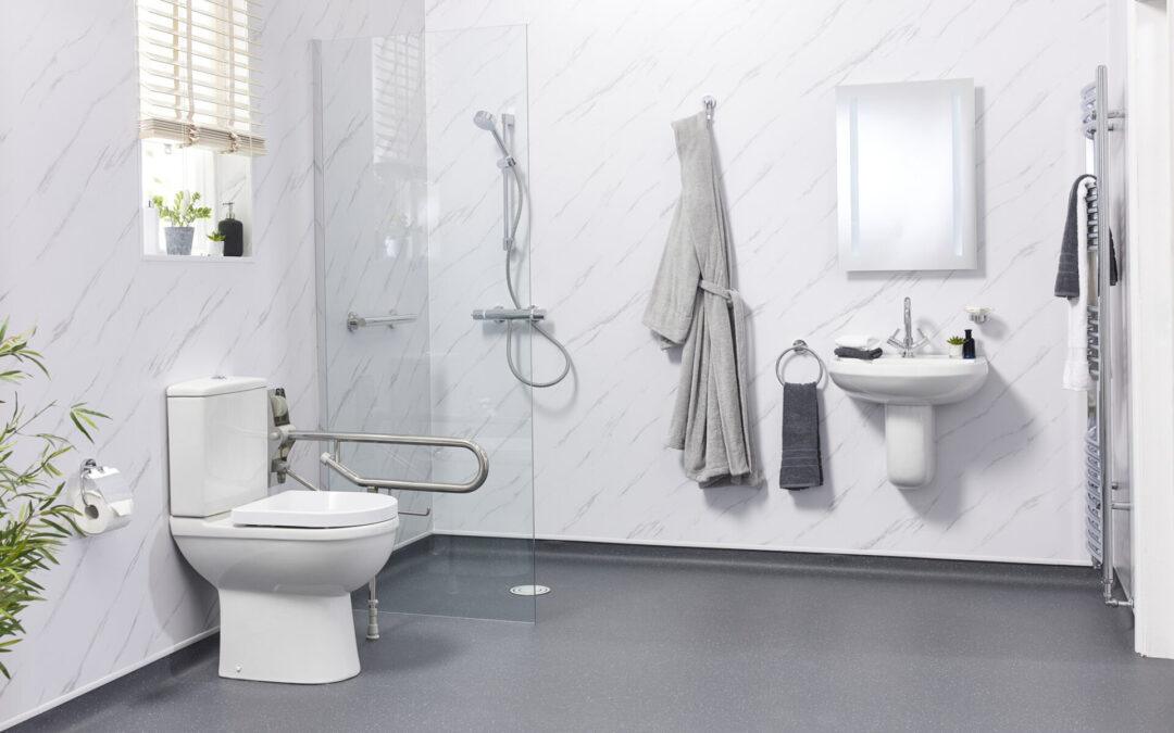 A clean, functional domestic wet room with level-access shower, non-slip flooring, and minimalist fixtures designed for home use.