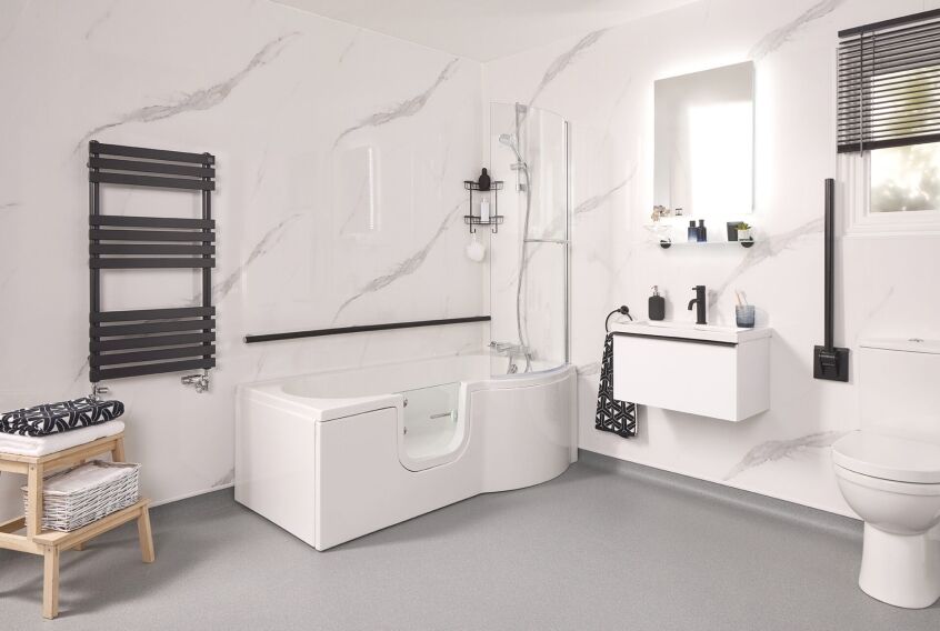 Full length walk-in bath with a low entry door installed in place of a standard tub