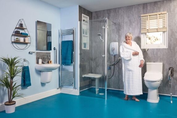 Accessible wet room with walk-in shower, grab rails and level-access flooring by EA Mobility