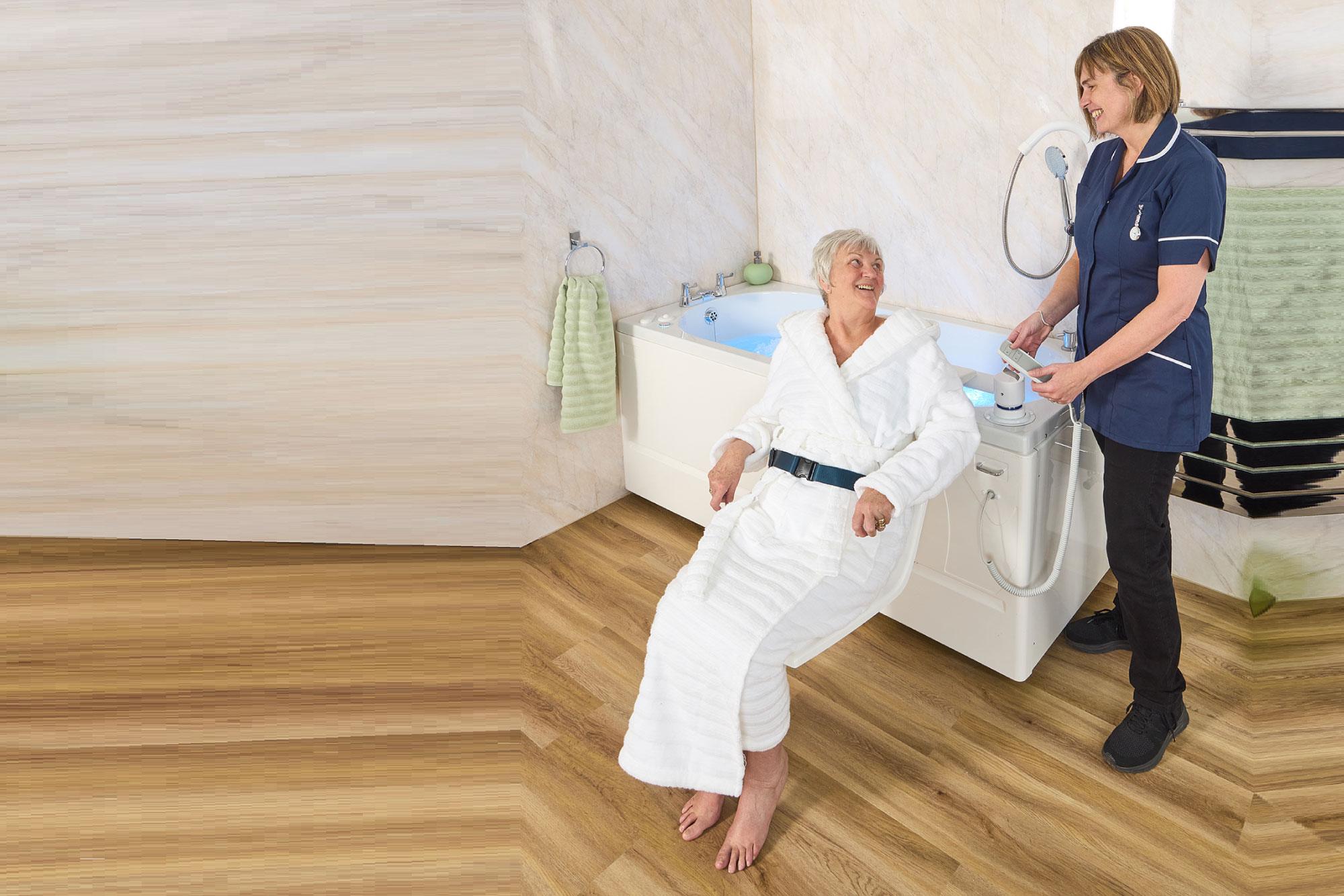 Assisted bath with transfer seat providing secure support for entry and exit