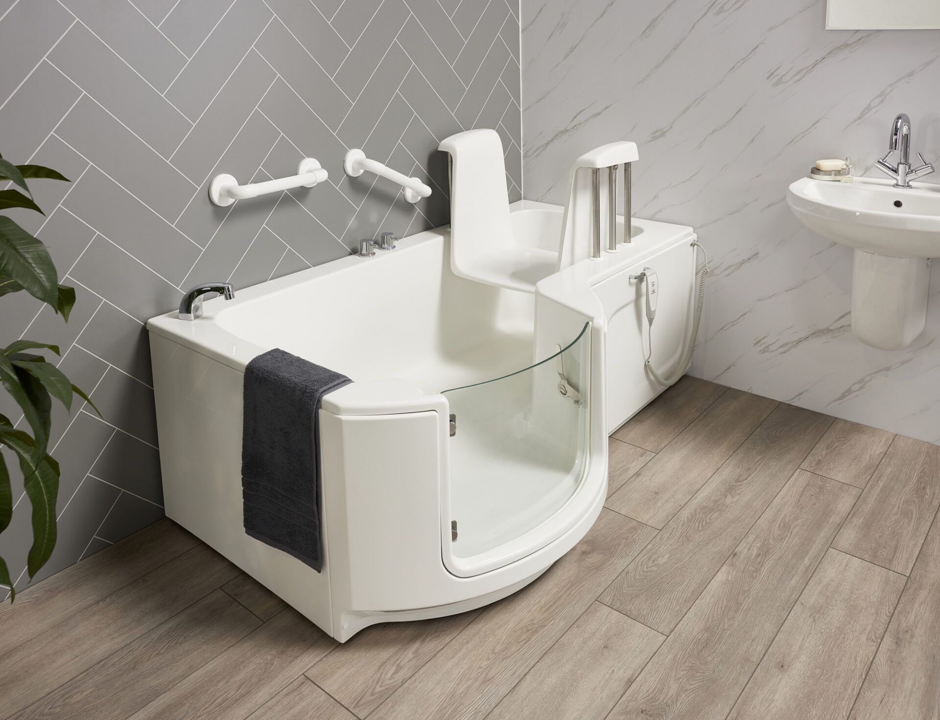 Electric bath lift chair in a bath, showing how high the seat sits above the bath floor