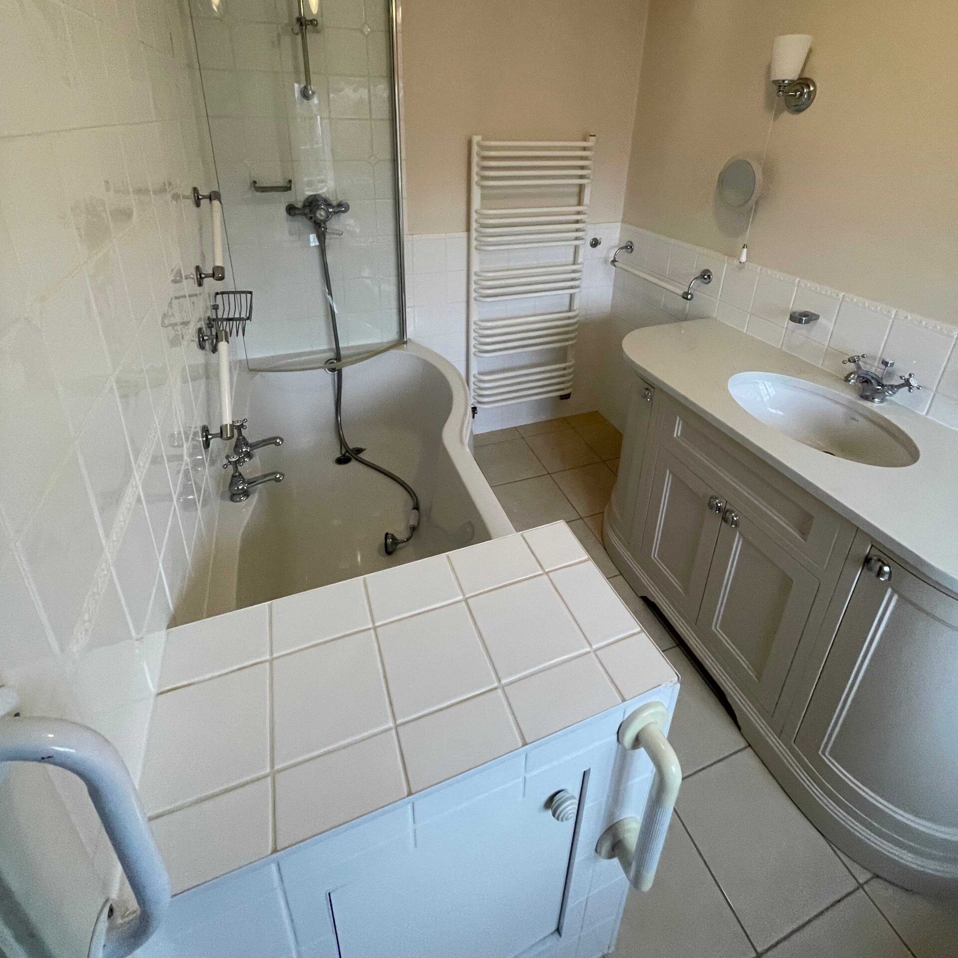 Andrew’s bathroom before adaptation, with a shower over the bath and stepped access