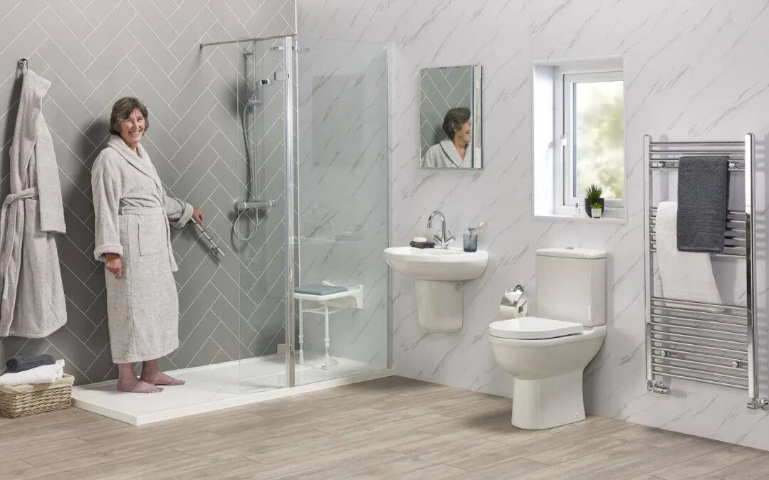 Older woman in a level-access walk-in shower with grab rails and shower seat