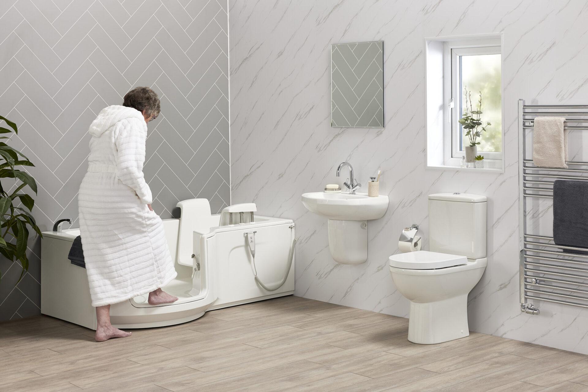 Walk-in bath with low-entry door and shower screen, installed by EA Mobility