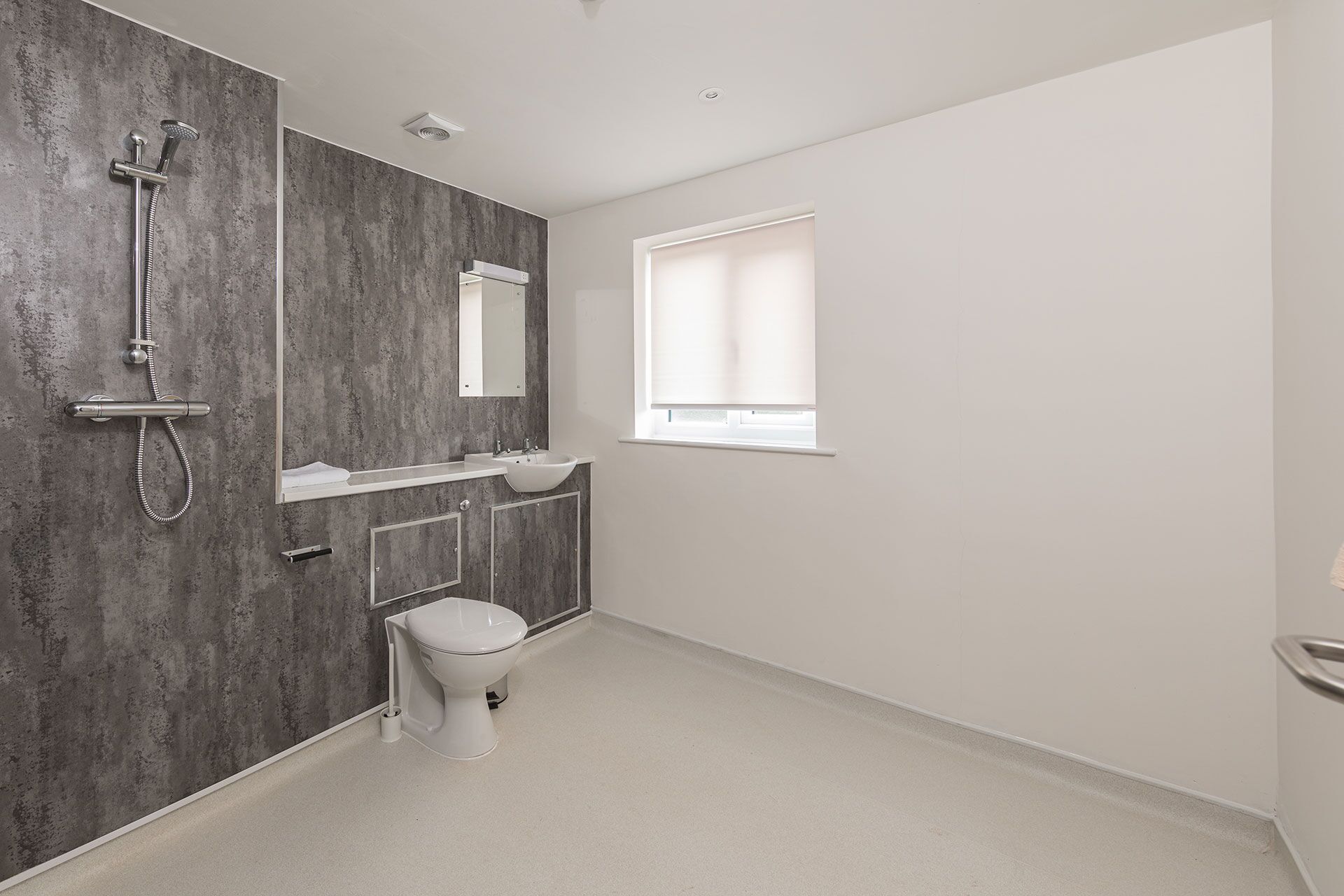 Wet room with a level floor, no shower tray and no step, suitable for wheelchair access