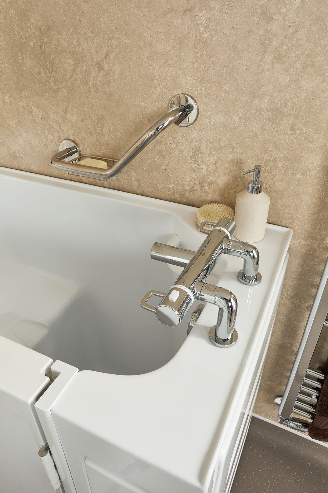 EA Mobility installer fitting a walk-in bath in a UK bathroom
