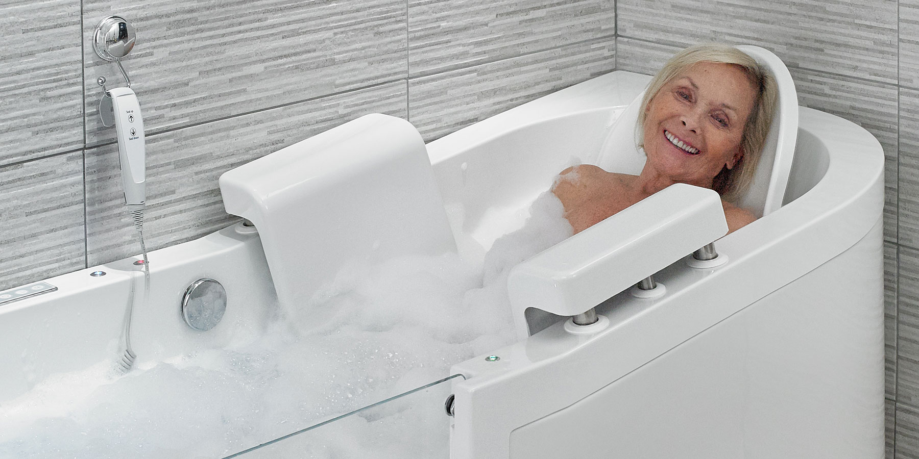 elderly woman in adapted bathtub