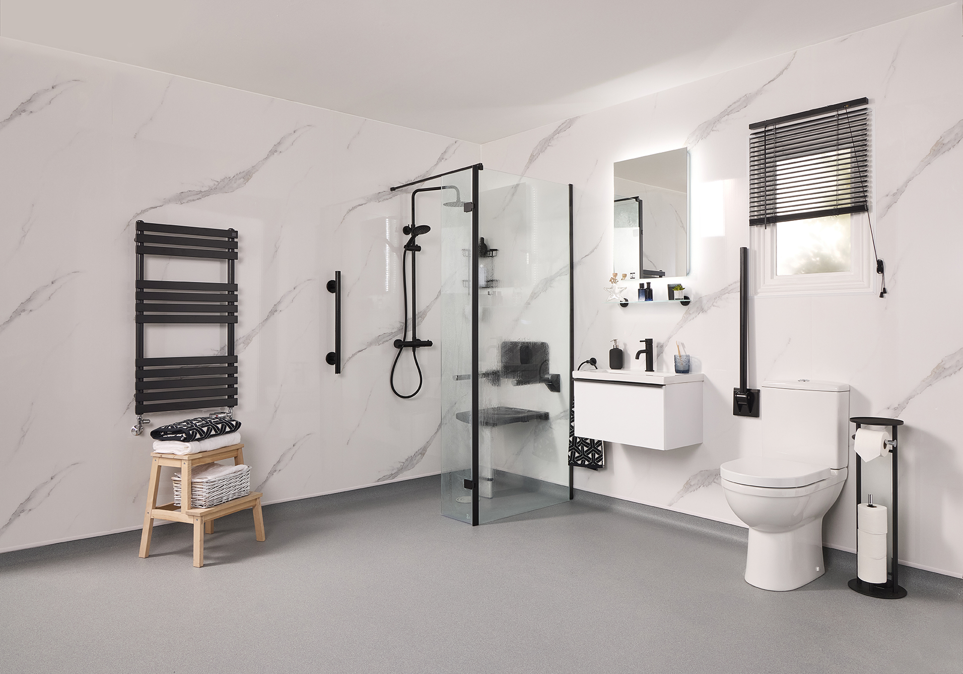Luxury disabled wet room with marble effect walls and matte black grab rails