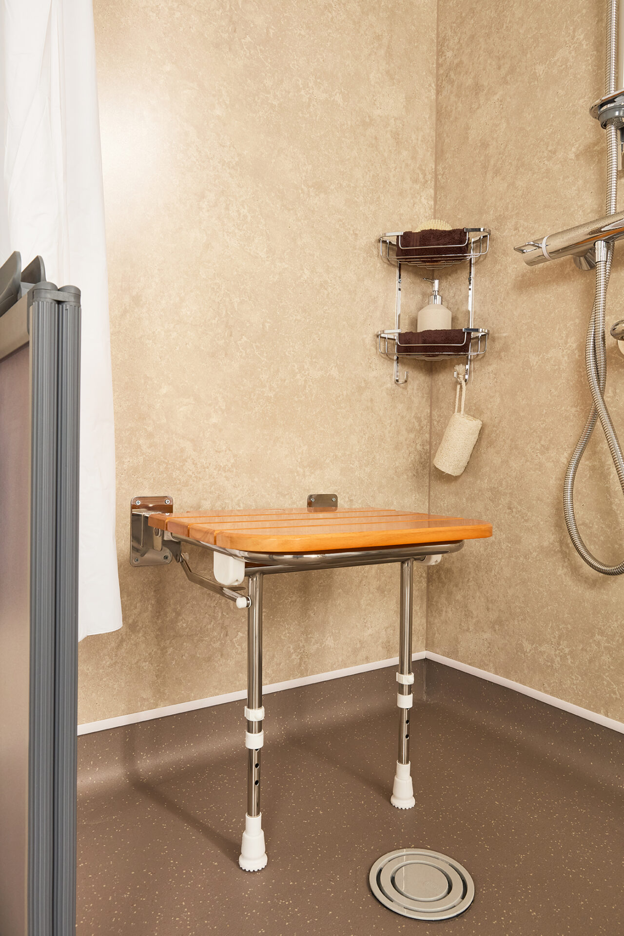 Fold-Down Shower Seat in bathroom