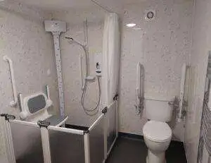 Stylish and accessible small disabled wet room