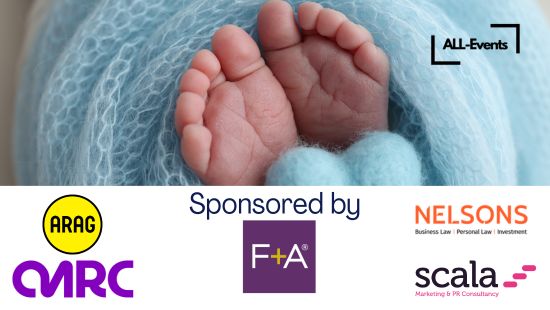 Older woman in bathrobe standing beside level-access shower with fold-down seat, grab rails, and anti-slip blue flooring in accessible bathroom