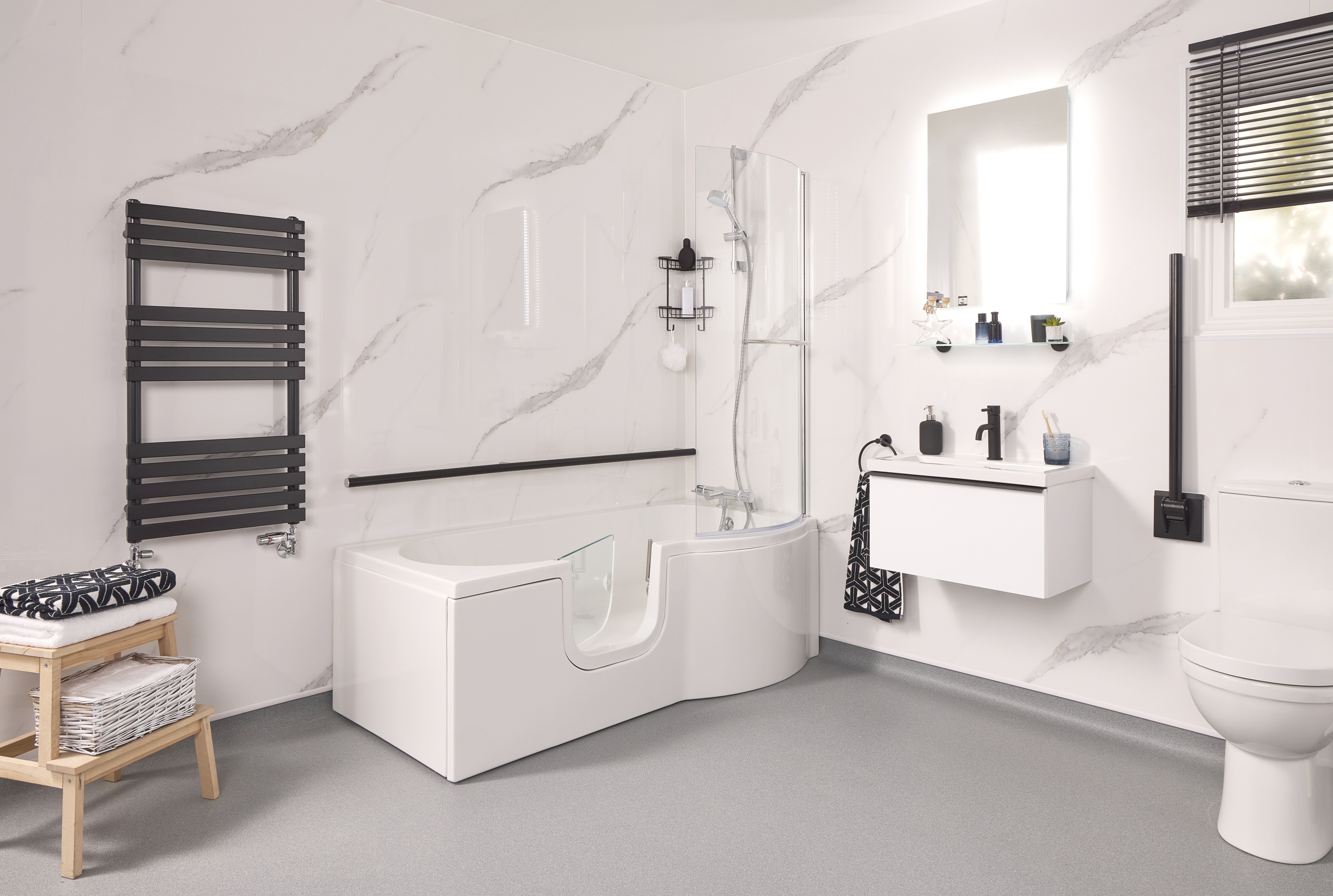 Modern full length walk in bath with watertight door open showing low step entry solution