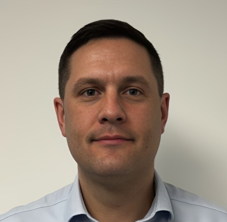 EA Mobility team member wearing light blue shirt in professional headshot