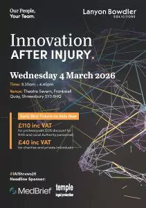 Older woman in bathrobe standing beside level-access shower with fold-down seat, grab rails, and anti-slip blue flooring in accessible bathroom