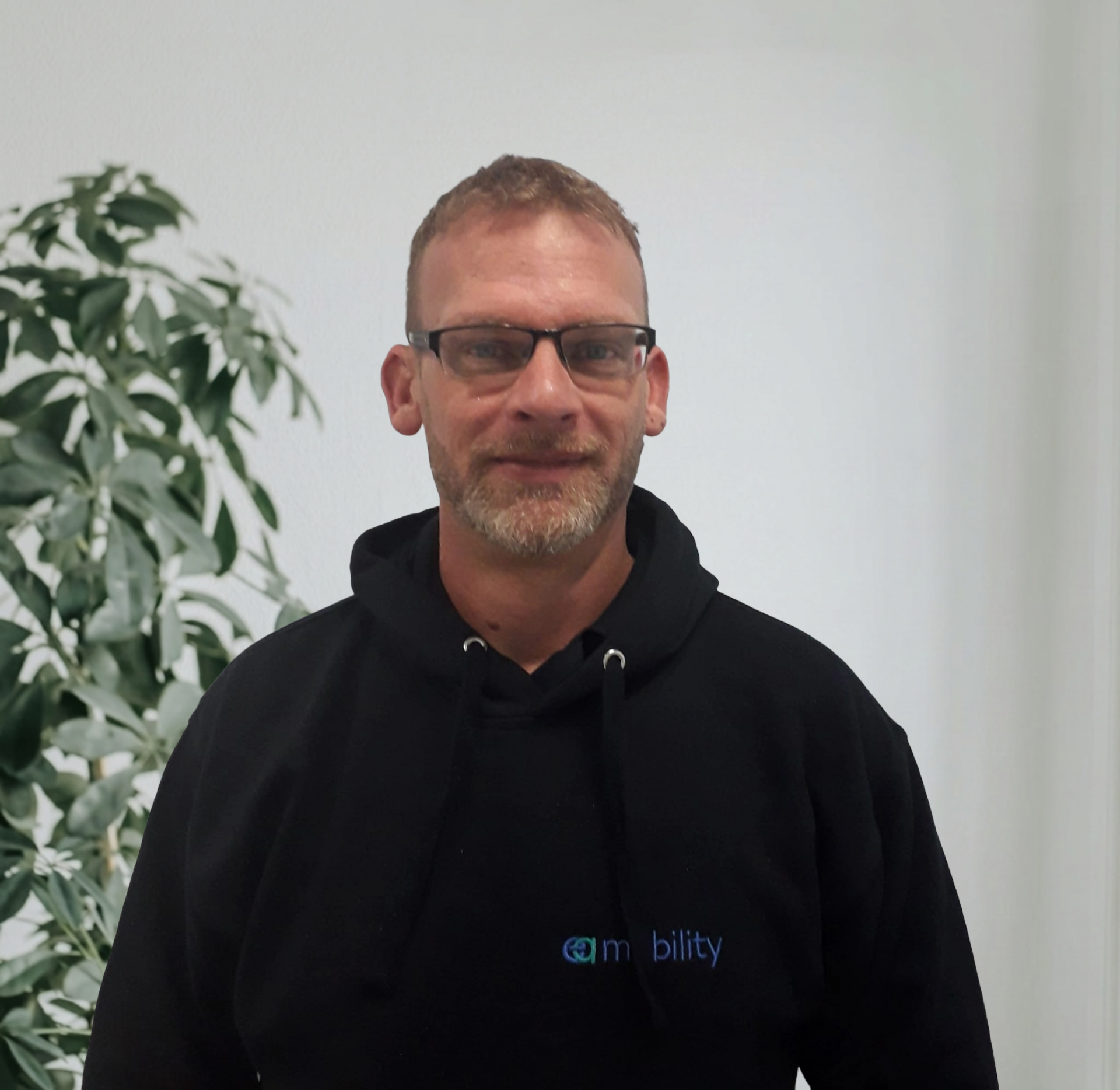 Kevin Carvell, Founder and Managing Director of EA Mobility, smiling in a professional setting.