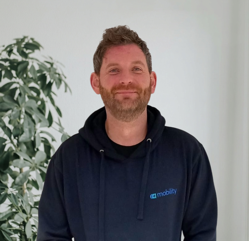 Kevin Carvell, Founder and Managing Director of EA Mobility, smiling in a professional setting.