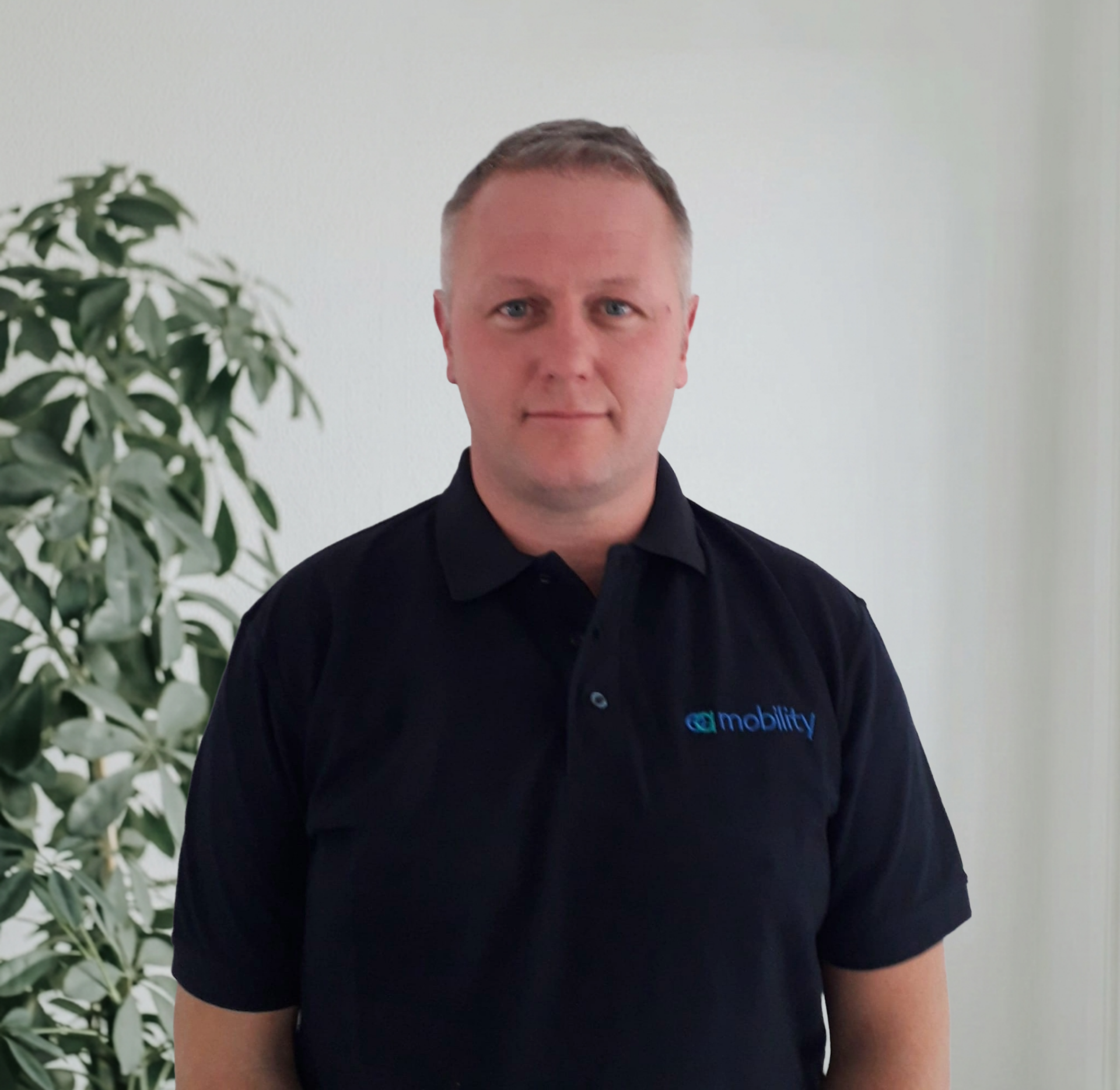 Kevin Carvell, Founder and Managing Director of EA Mobility, smiling in a professional setting.