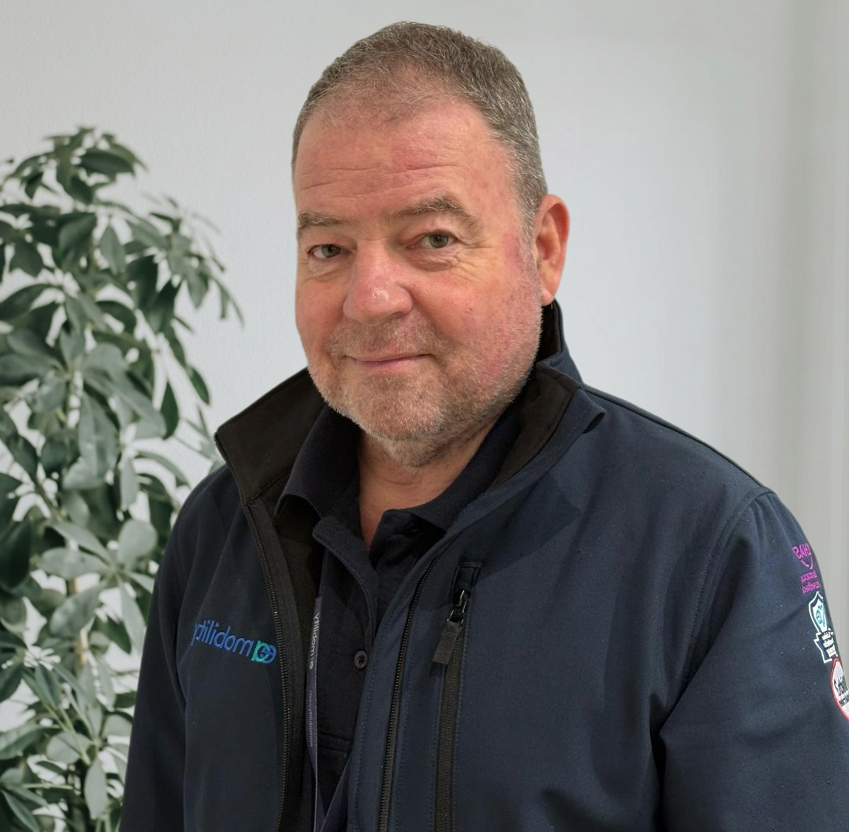 Kevin Carvell, Founder and Managing Director of EA Mobility, smiling in a professional setting.