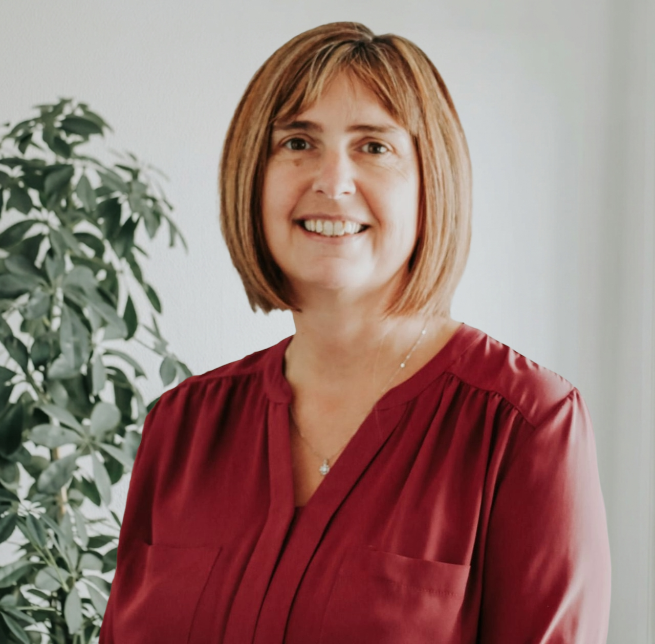EA Mobility team member wearing light blue shirt in professional headshot