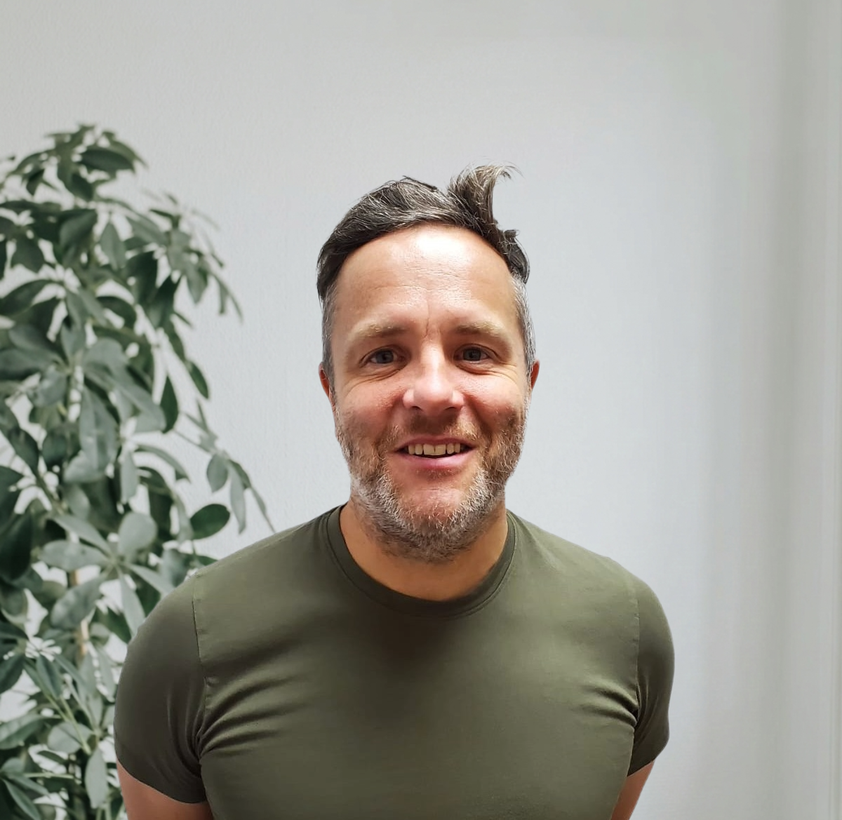 EA Mobility team member wearing light blue shirt in professional headshot