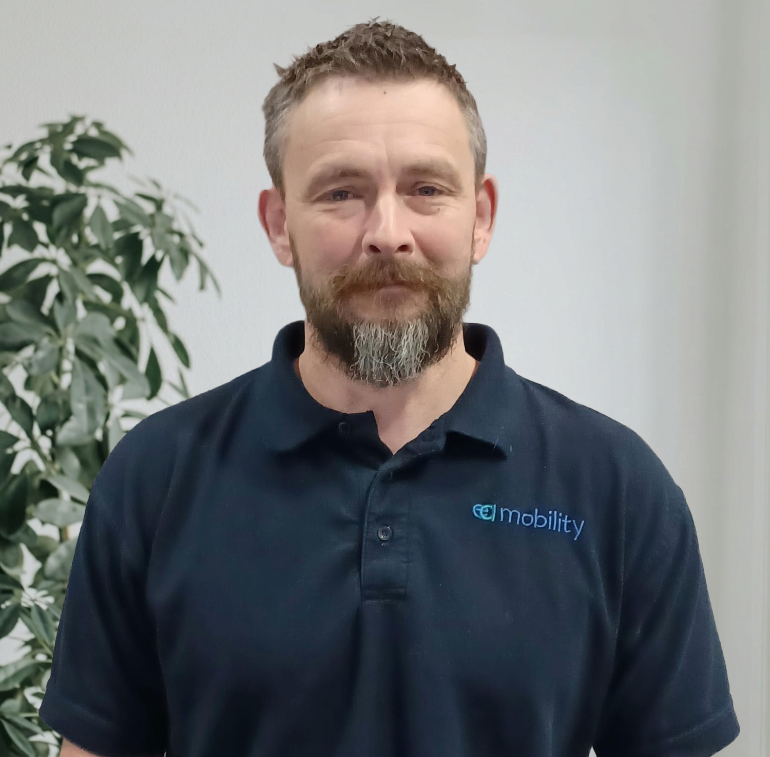 Kevin Carvell, Founder and Managing Director of EA Mobility, smiling in a professional setting.