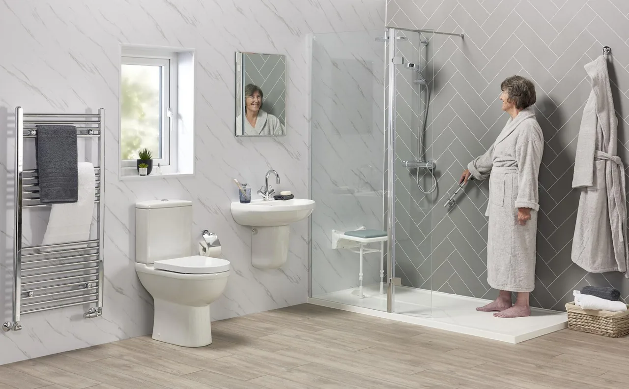Walk-in shower with level access and grab rails, installed by EA Mobility